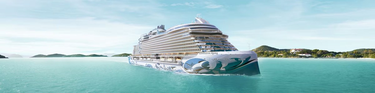 Norwegian Cruise Line Norwegian Prima sailing in turquoise waters representing streamlined group cruise management for travel agents