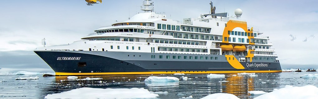 Quark Expeditions Ultramarine polar ship and helicopter in Antarctica showcasing specialized travel agent supplier education